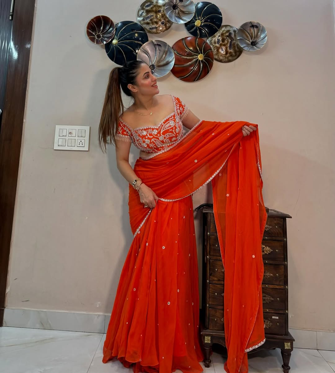 Glamorous Orange Embroidered Lehenga Saree