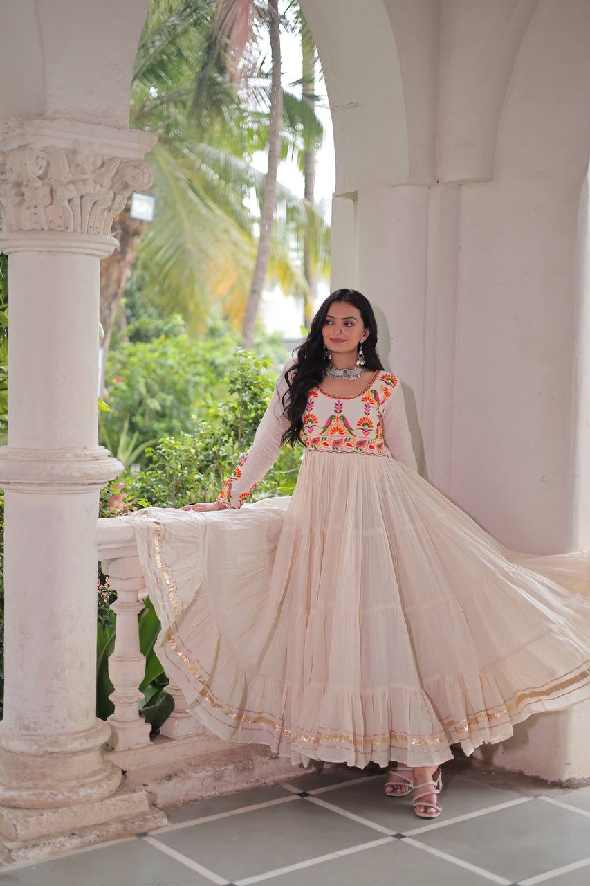 Aarvi's Grace Creamy Layers & Folk Bloom Embroidery Anarkali Gown