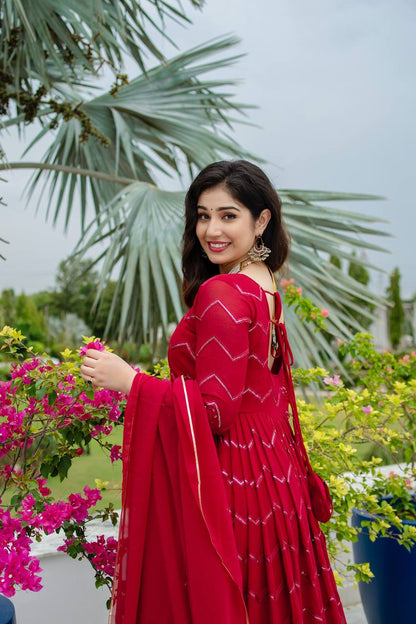 Grace in Every Twirl: Festive Red Magic Designer Anarkali Suit